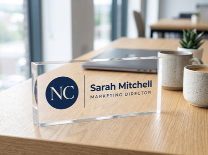 Custom acrylic desk name plate with company logo, name and job title on an office desk