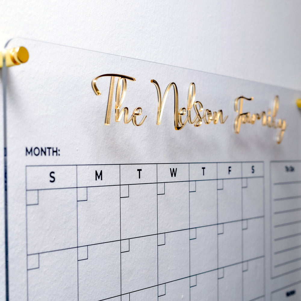 Gold 3D family name detail on acrylic planner