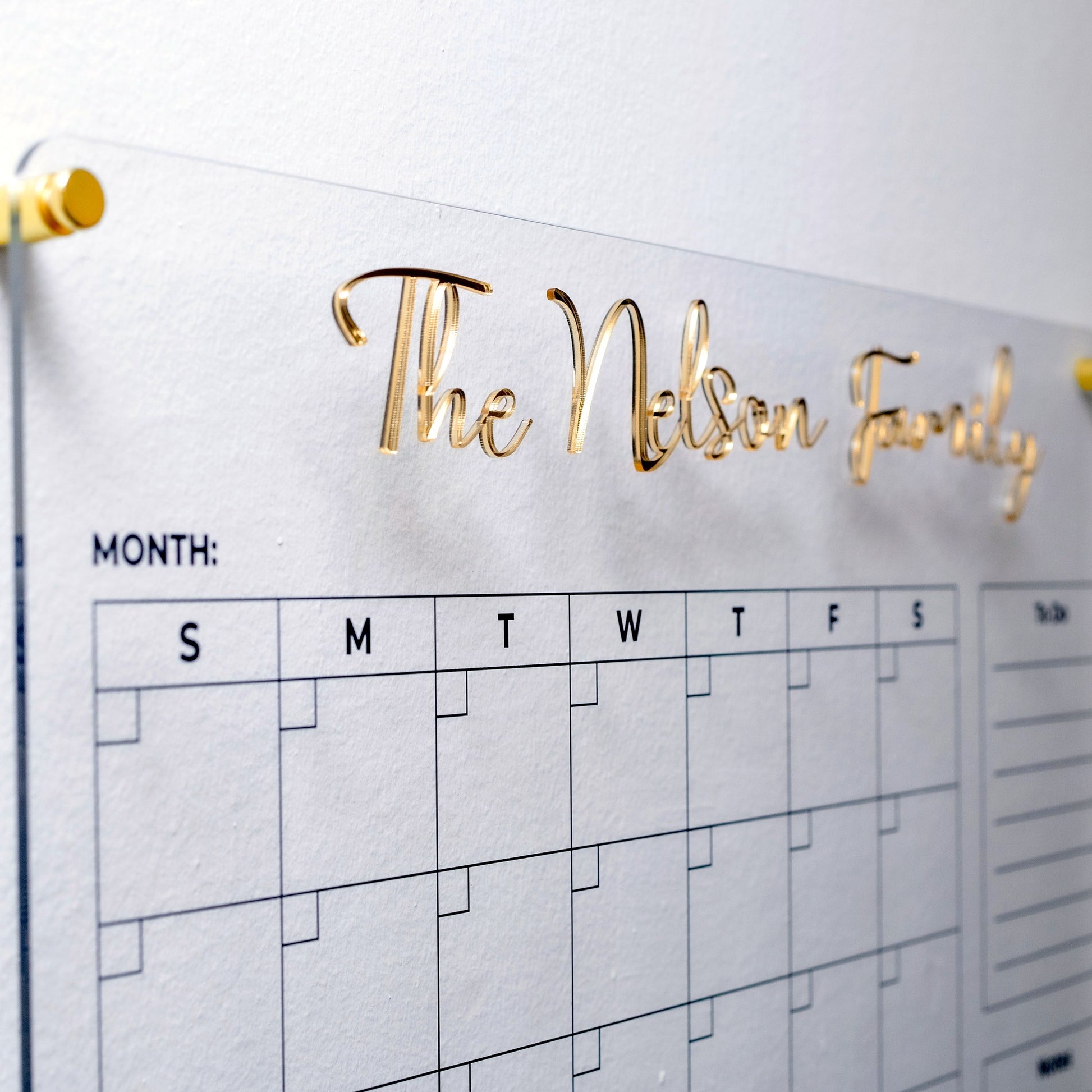 Gold 3D family name detail on acrylic planner