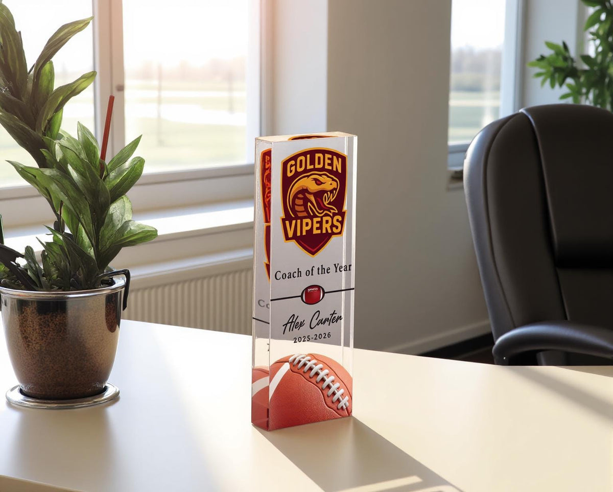 Acrylic football coach award on a desk