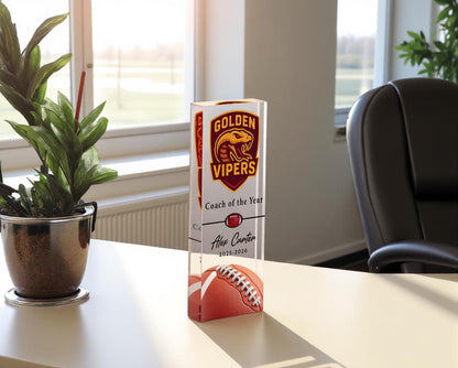 Acrylic football coach award on a desk
